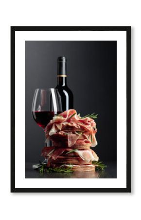 Spanish jamon or Italian prosciutto with bread, rosemary, and red wine.