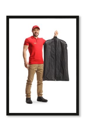 Full length profile shot of a male worker holding clothes on a hanger inside a cover case