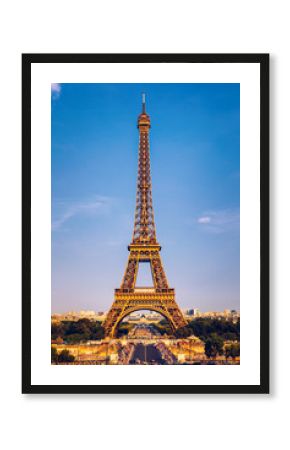 Eiffel tower in summer, Paris, France. Scenic panorama of the Eiffel tower under the blue sky. View of the Eiffel Tower in Paris, France in a beautiful summer day. Paris, France.