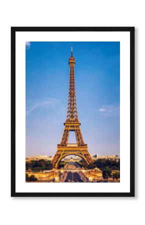 Eiffel tower in summer, Paris, France. Scenic panorama of the Eiffel tower under the blue sky. View of the Eiffel Tower in Paris, France in a beautiful summer day. Paris, France.