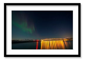 Norway, Tromso, Sommaroy, Aurora Borealis over illuminated bridge