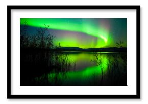 Northern lights mirrored on lake