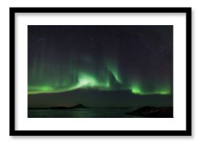 Northern lights over frozen lake Myvatn in Iceland