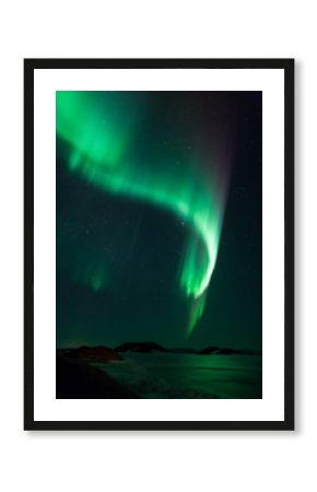 Northern lights over frozen lake Myvatn in Iceland