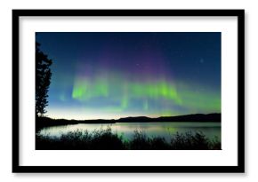 Summer night Northern lights over Lake Laberge