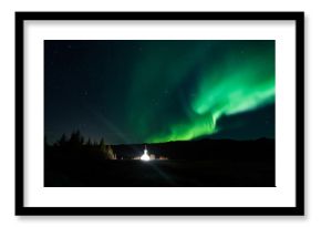 Northern lights above a church in Iceland