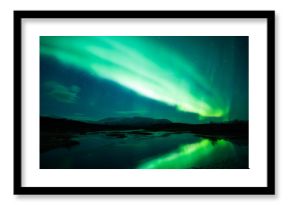 Northern lights above lagoon in Iceland