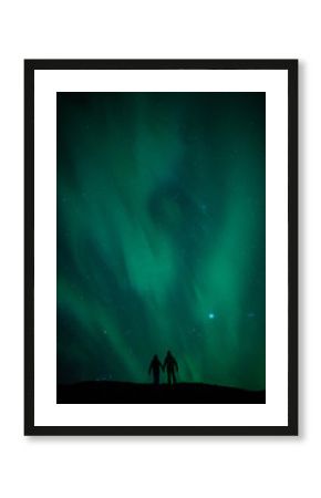 Northern lights above romantic couple