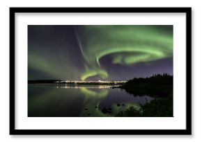 Aurora over Reykjavik city