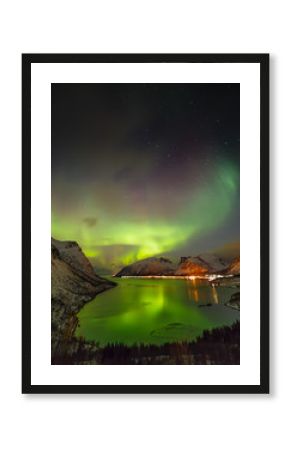 Aurora borealis (Polar lights) over the mountains in the North of Europe - Senja island, Troms county, Norway