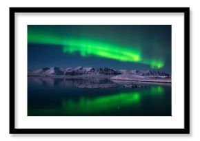 Northern lights over the glacier lagoon Jokulsarlon, Iceland