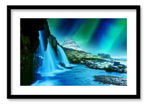 View of the northern light at dusk over Kirkjufell Mountain in Iceland.