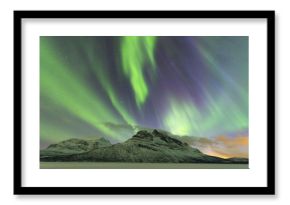 Northern Lights (Aurora borealis) on frozen lake Skoddebergvatnet, Grovfjord, Troms county, Lofoten Islands, Nordland