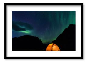 Illuminated Tent with northern lights in Lapland