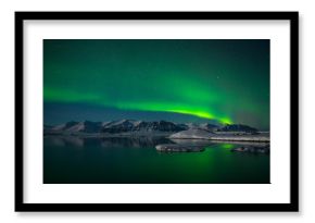 Northern lights over the glacier lagoon Jokulsarlon, Iceland