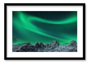 Aurora borealis above snowy islands