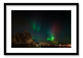 Aurora borealis (Polar lights) over the mountains in the North of Europe - Senja Island, Troms, Norway