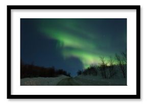 Aurora,Northern lights over the hills and road.