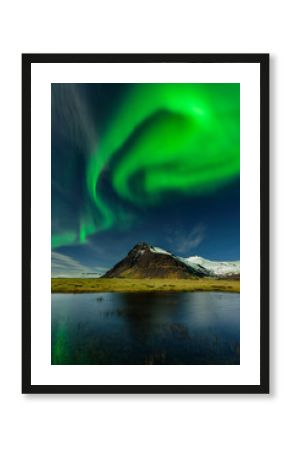 Northern light in Iceland an amazing paradise. Spectacular aurora borealis near the glacier lagoon Jokulsarlon. Beautiful nightscape.