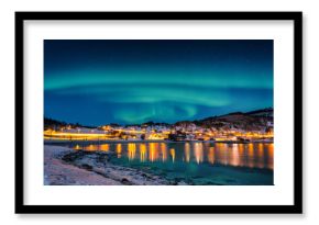 Northern lights, Aurora borealis in night sky over Gausvik, Lofoten Islands, Norway. Scenic winter landscape