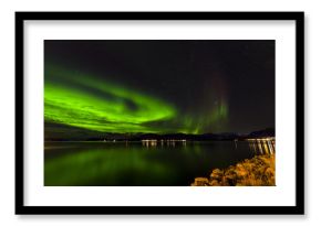 Amazing view of aurora borealis ( northern lights) over Norvegian sea . 