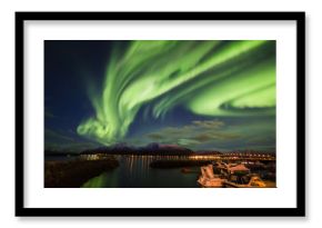 Amazing view of aurora borealis ( northern lights) over Norvegian sea . 