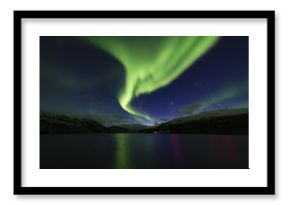 Amazing view of aurora borealis ( northern lights) over Norvegian sea . 