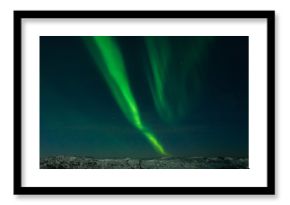 Beautiful stripes of the northern lights, aurora in the night sky above the hills.