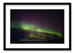 Colorful northern lights over a saskatchewan prairies winter landscape at night