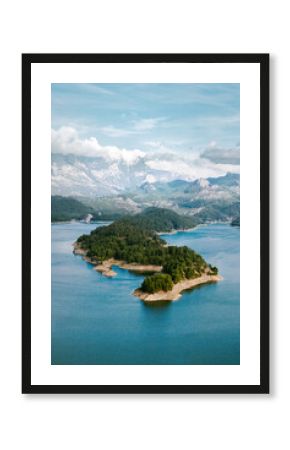 Aerial view landscape Karacaoren lake surrounded by mountains in Turkey. Forest island in turquoise water scenery wild nature travel beautiful destinations