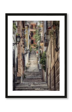 Old street with stairs in Granada in Spain.