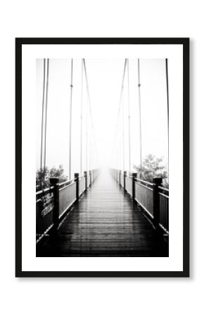 view on pedestrian wooden bridge in mist