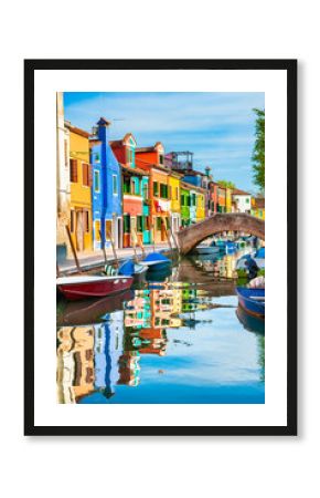 Colorful houses on the canal in Burano island, Venice, Italy.