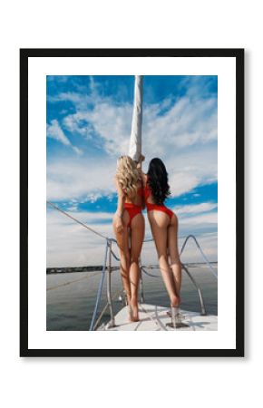 Beautiful girl in a swimsuit travels on a yacht on the sea and ocean.