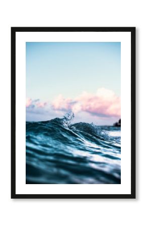 Beautiful Phenomenon of Clear Blue Wave Breaking Creating Heart Shaped Splash with Colorful Sunset Sky in Scenic Background in Tranquil Tropical Island Paradise Nature Scene of Maui Hawaii