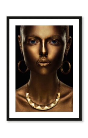 portrait of a beautiful sexy blonde girl with correct facial features artfully covered with gold paint