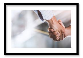 Two engineer shaking hands with deals and congratulations on success, panorama image use for cover design.