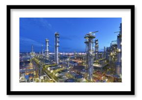 refinery - chemical factory at night with buildings, pipelines and lighting - industrial plant