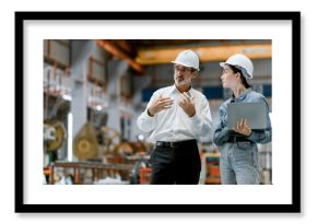 Portrait of female engineer team standing and working in industrial factory. Professional engineering, worker, woman Quality control. Male and female industrial engineers using tablet computer.