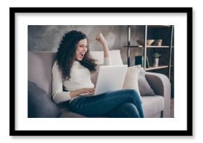 Portrait of her she nice-looking attractive lovely cheerful cheery wavy-haired girl using laptop celebrating accomplishment in modern loft industrial style interior room indoors