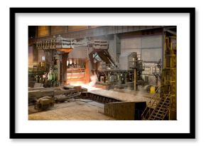 Burning forge inside of spacious metal workshop ready to produce metal structure in industrial building of modern factory in Asturias