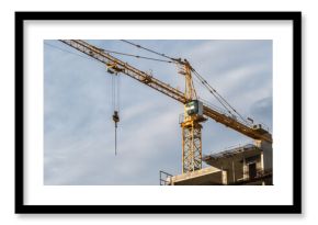 Construction site with cranes and building under construction