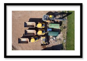  Aerial view of quarrying vehicles parked by a field