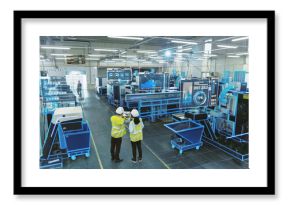 Two Engineers in Safety Vests Use a Tablet to Interact With Holographic Data in a High-tech Factory, Activate AI Facility Analysis, Advanced Machinery, Digital Interfaces, Futuristic Manufacturing