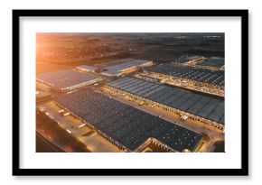 Night aerial view of a warehouse of goods for online stores. Logistic center in the industrial area of the city from above.