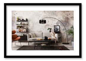 The stylish compostion at living room interior with design gray sofa, armchair, black coffee table, lamp and elegant personal accessories. Loft and industrial interior. Template. .