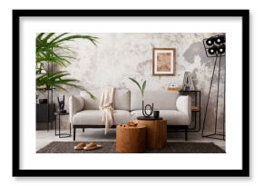 The stylish compostion at living room interior with design gray sofa, armchair, woooden coffee table, lamp and elegant personal accessories. Loft and industrial interior. Template.