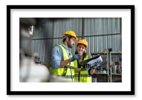 Portrait of female automation engineer team standing and working in industrial factory. 