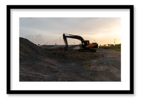Development in progress, excavator on a construction site