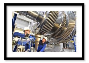 professional industrial Teamwork - workers manufacturing steam turbines in an industrial factory